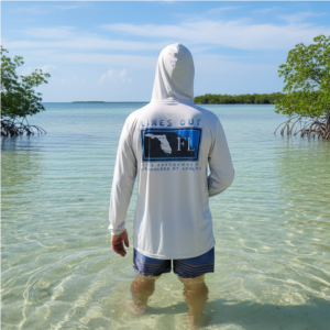 Long sleeve hooded UPF 50 performance shirt for anglers and outdoor enthusiasts, lightweight, breathable, moisture-wicking, sun-protective shirt for fishing, hiking, and outdoor adventures.